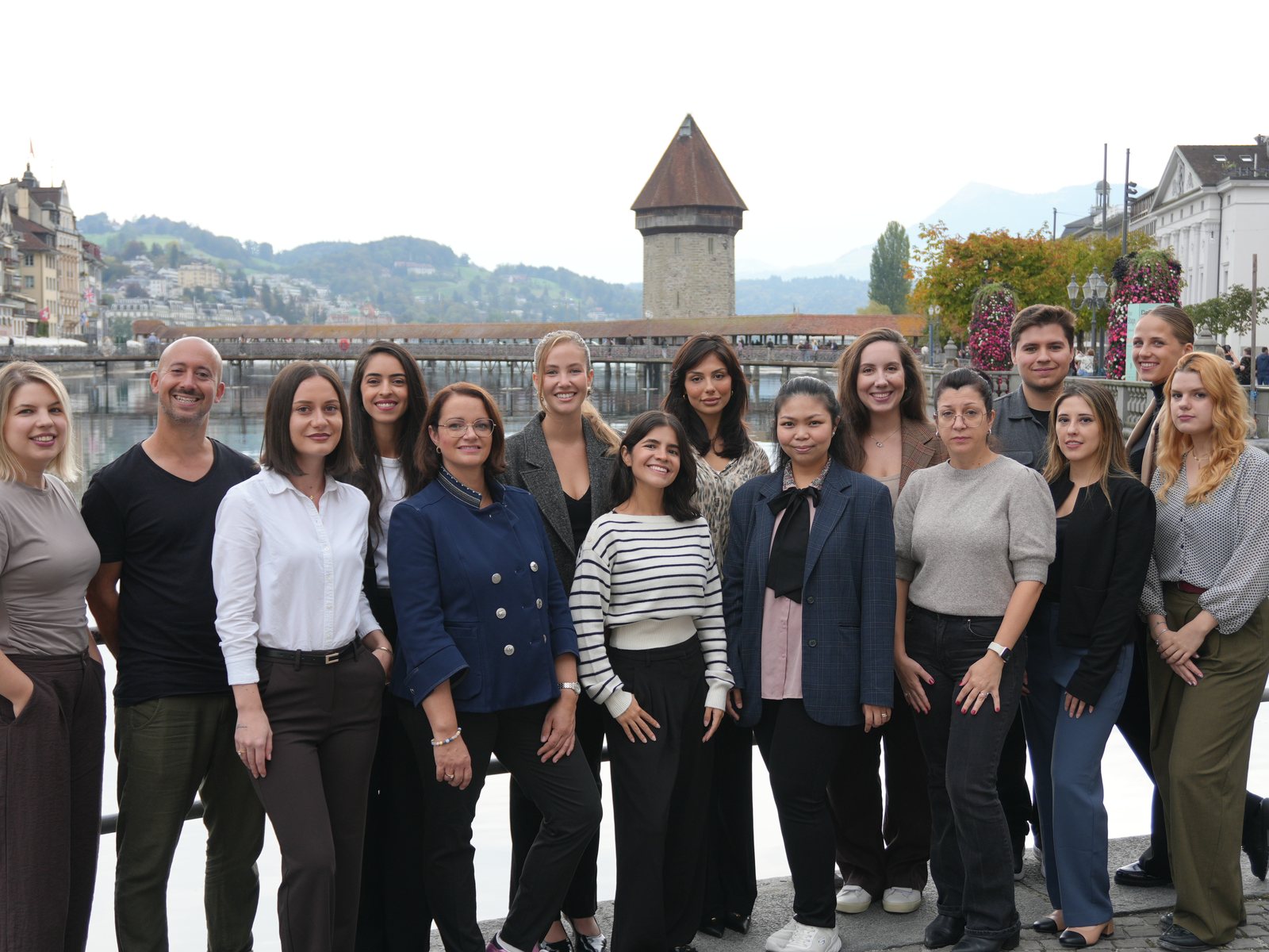 The Salona Consulting team on the Reuss in Lucerne, the Chapel Bridge behind them